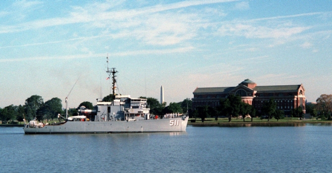 Sailors “man the rails” as Affray glides past the Naval War College while standing down the channel from Newport for the Washington Navy Yard, 22 July 1983. The ship sports a fresh coat of paint following her overhaul there. (Don S. Montgomery, Department of Defense Photograph 330-CFD-DN-SC-83-11895, Record Group 330 Records of the Office of the Secretary of Defense, 1921–2008, National Archives and Records Administration)