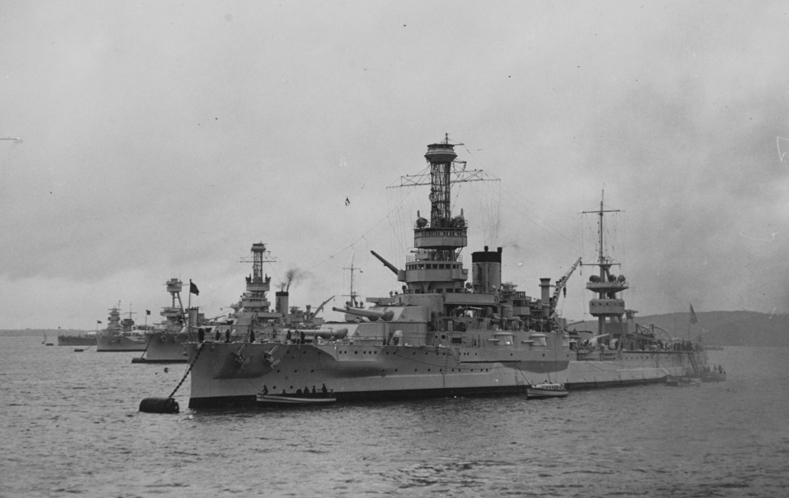Arkansas and her embarked midshipmen visit Kiel, Germany, 1937. The ships in the background (right–left) are Wyoming, New York, and a German Deutschland class Panzerschiffe (armored ship), popularly known as a “pocket battleship.” (Naval History and Heritage Command Photograph NH 59944)