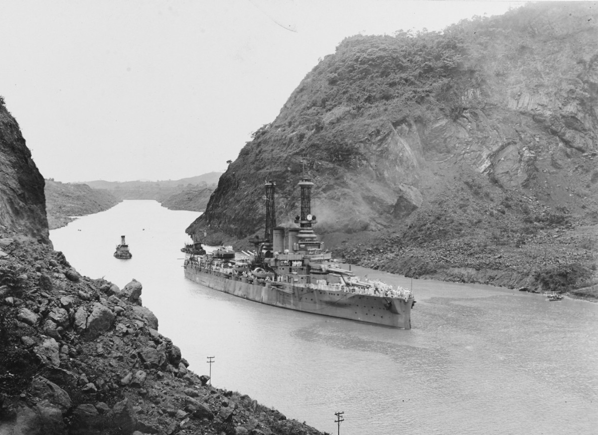 Arkansas passes through the Gaillard Cut [Culebra Cut] of the Panama Canal as she steams toward the Pacific, 26 July 1919. (Naval History and Heritage Command Photograph NH 3)