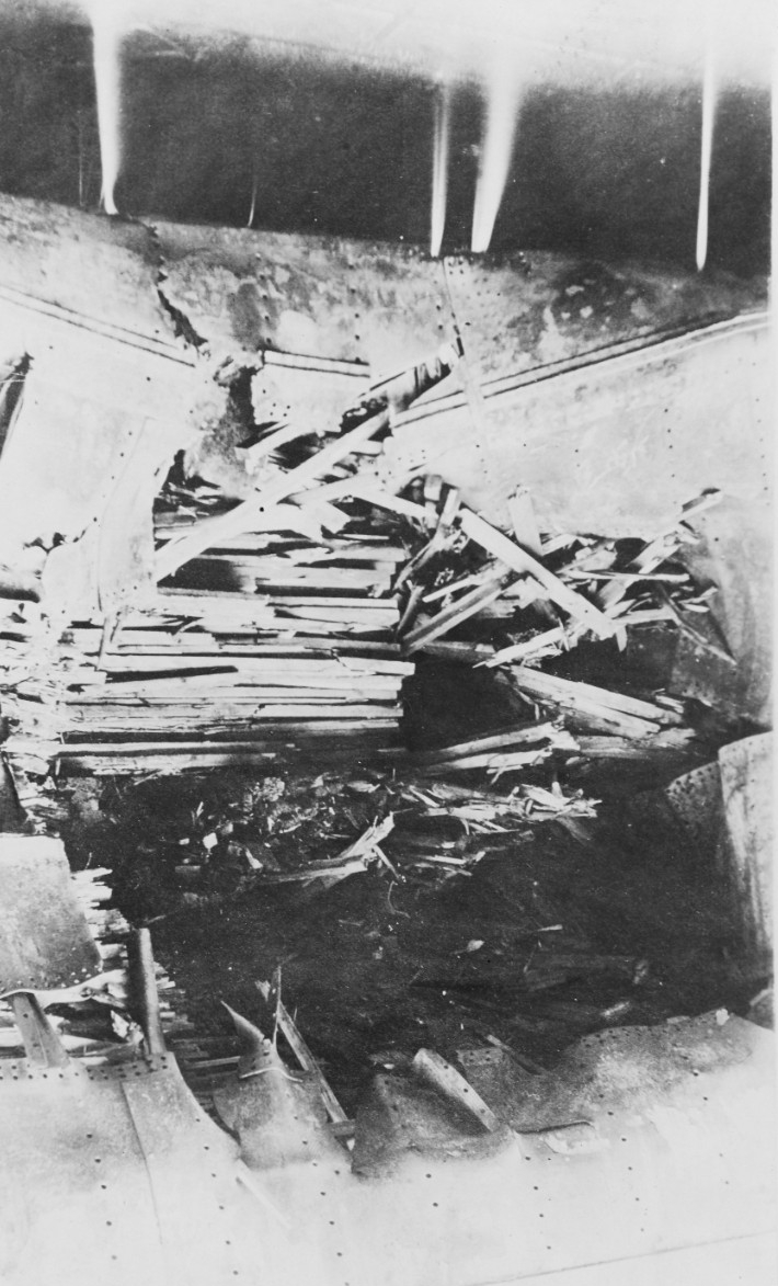 Torpedo damage – a hole measuring 20 by 21 feet in size – by her No. 6 hold at the engine room bulkhead, photographed while she lay in dry dock at the Haulbowline Shipyard, Queenstown. (Courtesy of Capt. David C. Hanrahan, November 1929, Naval Hi...