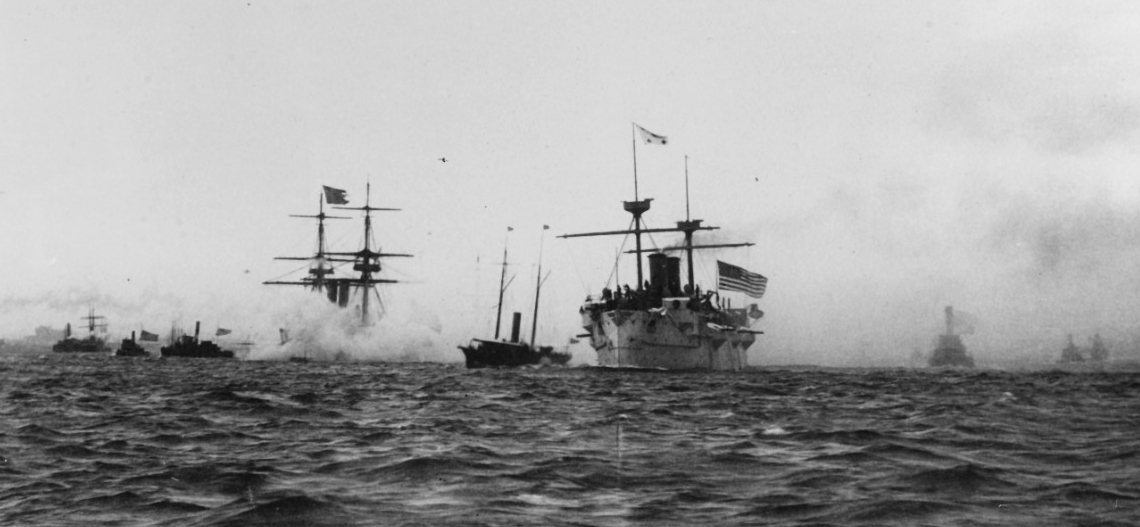 Baltimore leaving New York Harbor on 23 August 1890, en route to return the remains of John Ericsson to Sweden. Boston is in the left center, flying the Swedish ensign from her mast peak. (Naval History and Heritage Command Photograph NH 69176)