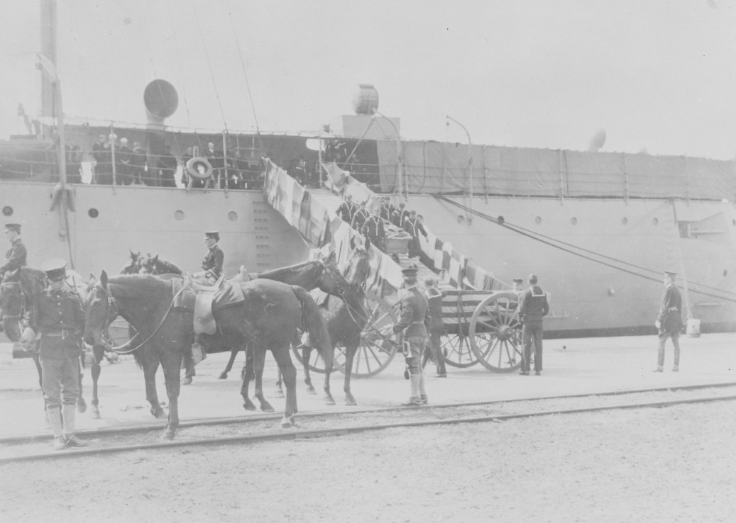 Birmingham brings the flag-draped caskets of the fallen crew of Maine to the Washington Navy Yard, 23 March 1912. (Naval History and Heritage Command Photograph NH 1686)