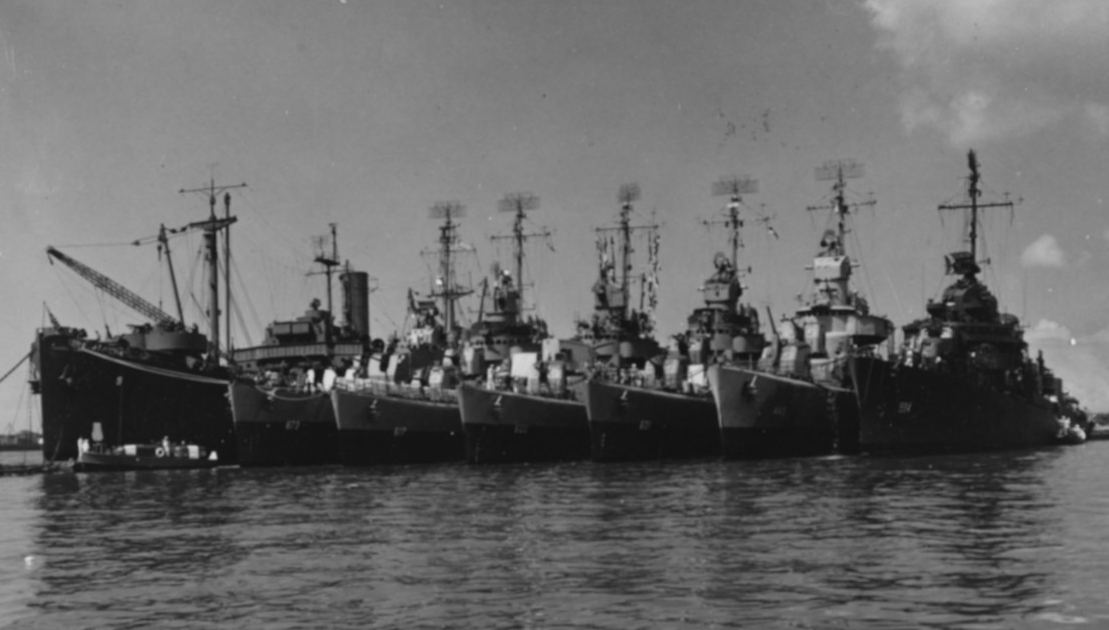 Black Hawk with six destroyers alongside, probably at Pearl Harbor, Hawaii, July 1945. The destroyers are (from left to right): Hawkins (DD-873); Ordronaux (DD-617); Boyle (DD-600);   Champlin (DD-601); Swanson (DD-443); and Franks (DD-554). (U.S. Navy Photograph 80-G-354885, National Archives and Records Administration, Still Pictures Division, College Park, Md.) 