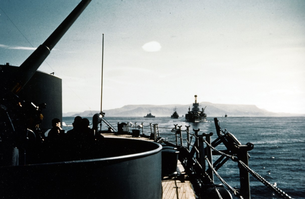 TF 19 sets sail from Reykjavik, Iceland, after landing the marines to help defend the country, 13 July 1941. Seen from the quarterdeck of New York (BB-34), Arkansas (BB-33) is the next ship astern, followed by Brooklyn, and then Nashville (CL-43)...