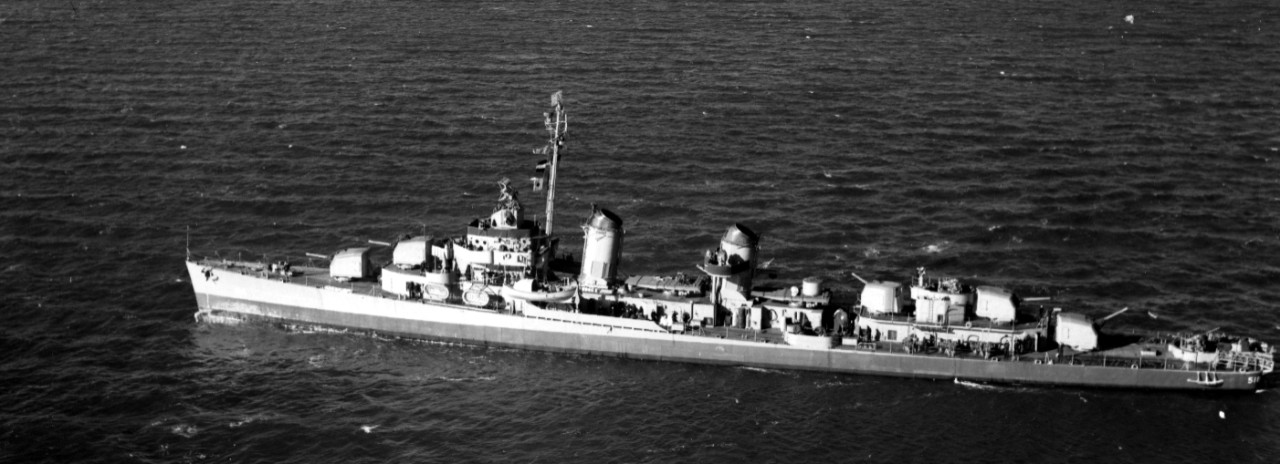 Brownson as seen from an altitude of 300 feet by a photographer in a plane from Naval Air Station New York, 18 February 1943. Note that her search and fire control radars have been installed and an additional 20-millimeter gun has been installed on the main deck, port and starboard. She retains the 40-millimeter twins as originally fitted. (Bureau of Ships Photograph BS 40834, National Archives and Records Administration, Still Pictures Division, College Park, Md.)