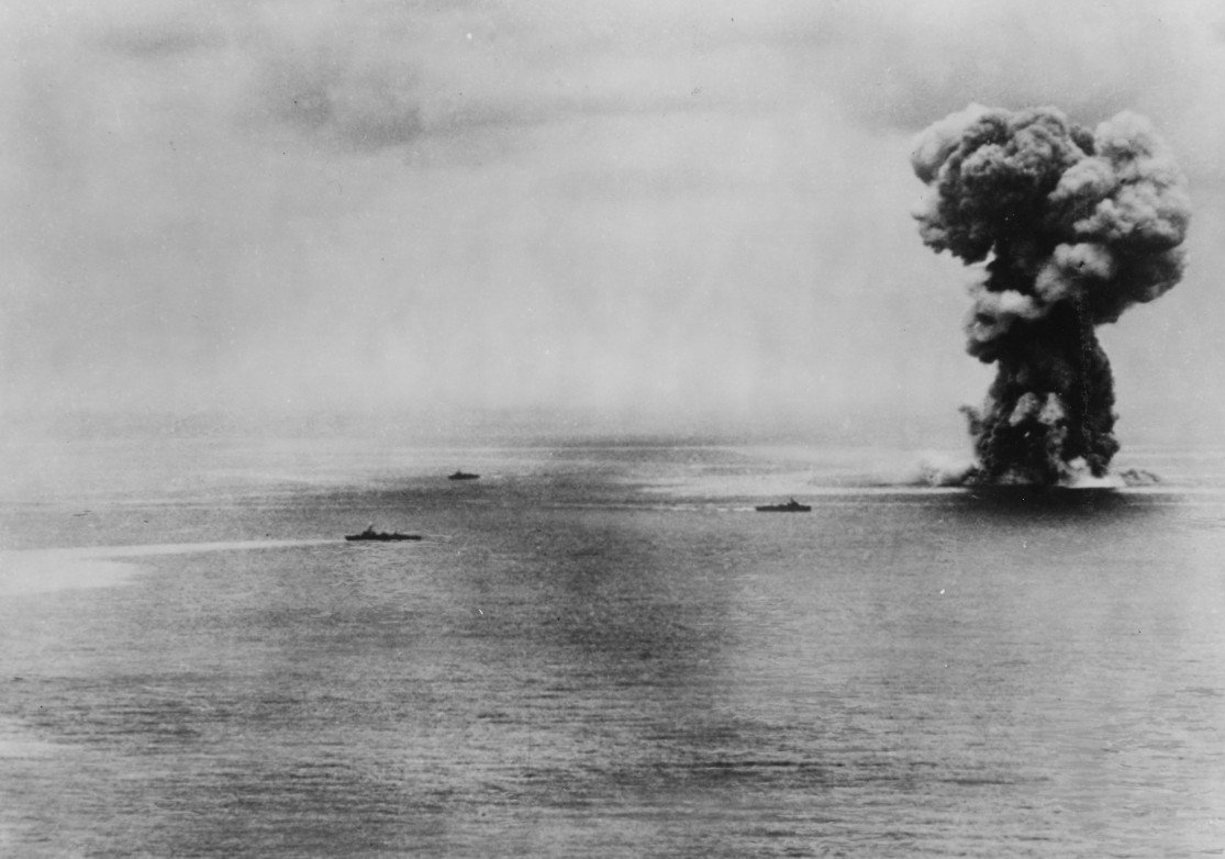 Aircraft from Bunker Hill’s air group help sink Japanese battleship Yamato (right) as she attacks Allied ships off Okinawa during Operation Ten-Go, 7 April 1945. A catastrophic explosion rocks the ship as she sinks, most likely from the detonation of 18.1-inch shells stored in one of the magazines. (U.S. Navy Photograph 80-G-413914, National Archives and Records Administration, Still Pictures Division, College Park, Md.)