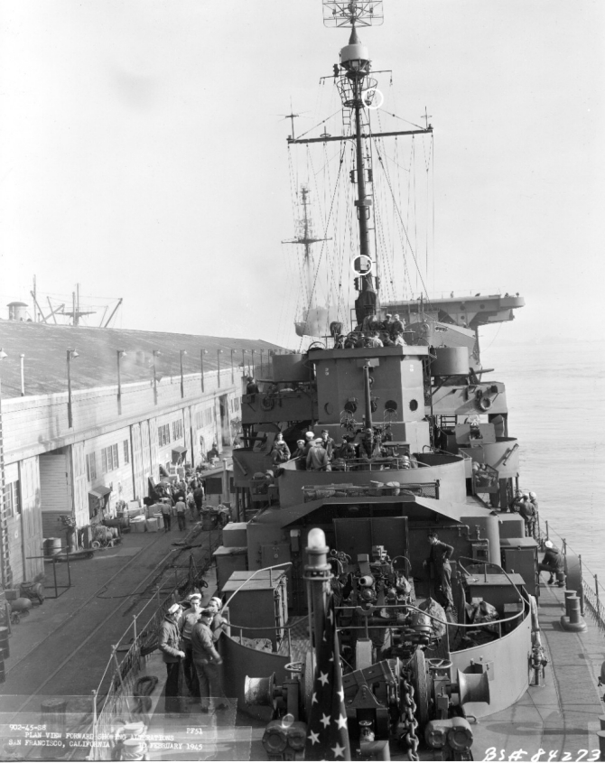 Burlington lies moored at San Francisco, 10 February 1945, ahead of Long Island (CVE-1), the U.S. Navy’s first escort carrier. Note Burlington’s 3-inch/50 mount 32 at high elevation, and two small Japanese flags on each side of her bridge, indicating planes shot down. (U.S. Navy Bureau of Ships Photograph 19-N-84273, Record Group 19 LCM Photographs, Box 510, National Archives and Records Administration, Still Pictures Branch, College Park, Md.)