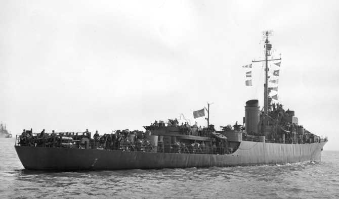 National ensign and signal flags snapping in a brisk breeze, some of her crew standing as if posing for the photographer, Burlington steams in San Francisco Bay on 16 February 1945, shortly before sailing for the Aleutian Islands.  (U.S. Navy Bureau of Ships Photograph 19-N-84270, Record Group 19 LCM Photographs, Box 510, National Archives and Records Administration, Still Pictures Branch, College Park, Md.)