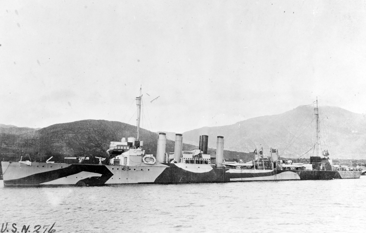 Caldwell moored in an unidentified harbor, 1918, painted in pattern camouflage. Note shields on the amidships ’4-inch mounts, but lack of a shield on the forward and aft mounts. (Naval History and Heritage Command Photograph NH 52854)