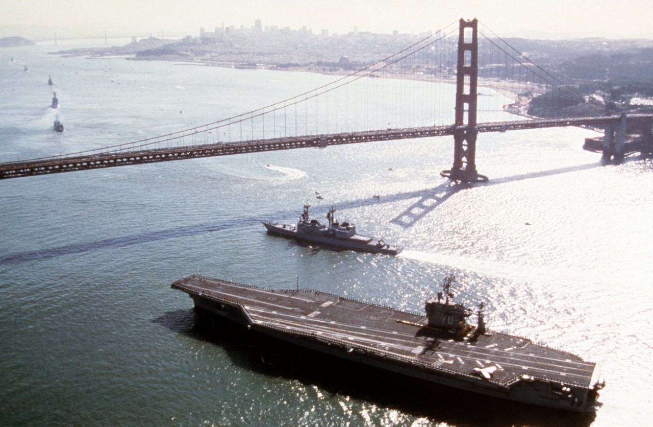 In company with the nuclear-powered aircraft carrier Carl Vinson (CVN-70), Callaghan approaches the Golden Gate Bridge en route to San Francisco for Fleet Week, 12 October 1985. (U.S. Navy Photograph DN-ST-86-01373, PH2 David A. Dostie, National ...