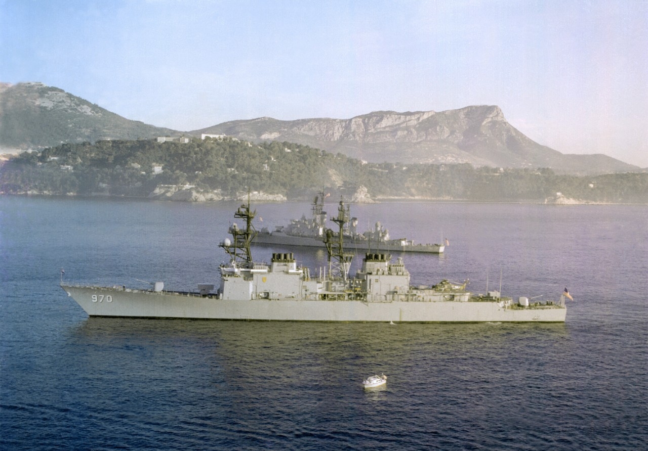 Caron anchored in the harbor at Toulon, France, with guided missile destroyer Mahan (DDG-42) in the background, 12 November 1979. (U.S. Navy Photograph DN-SC-82-00304, PHC C. Pedrick, National Archives and Records Administration, Still Pictures D...