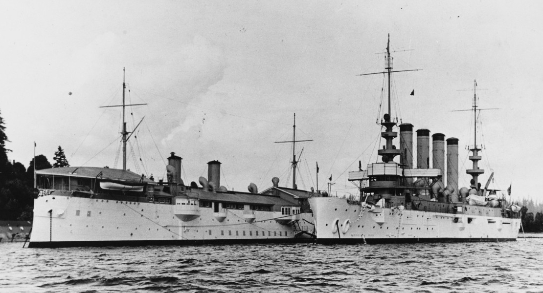 Philadelphia (Cruiser No. 4) (left) and Charleston at Puget Sound Navy Yard prior to World War I, when Philadelphia serves as a receiving ship. Note the contrast between Charleston’s brightly painted hull and her drab stacks. (Naval History and Heritage Command Photograph NH 92172)