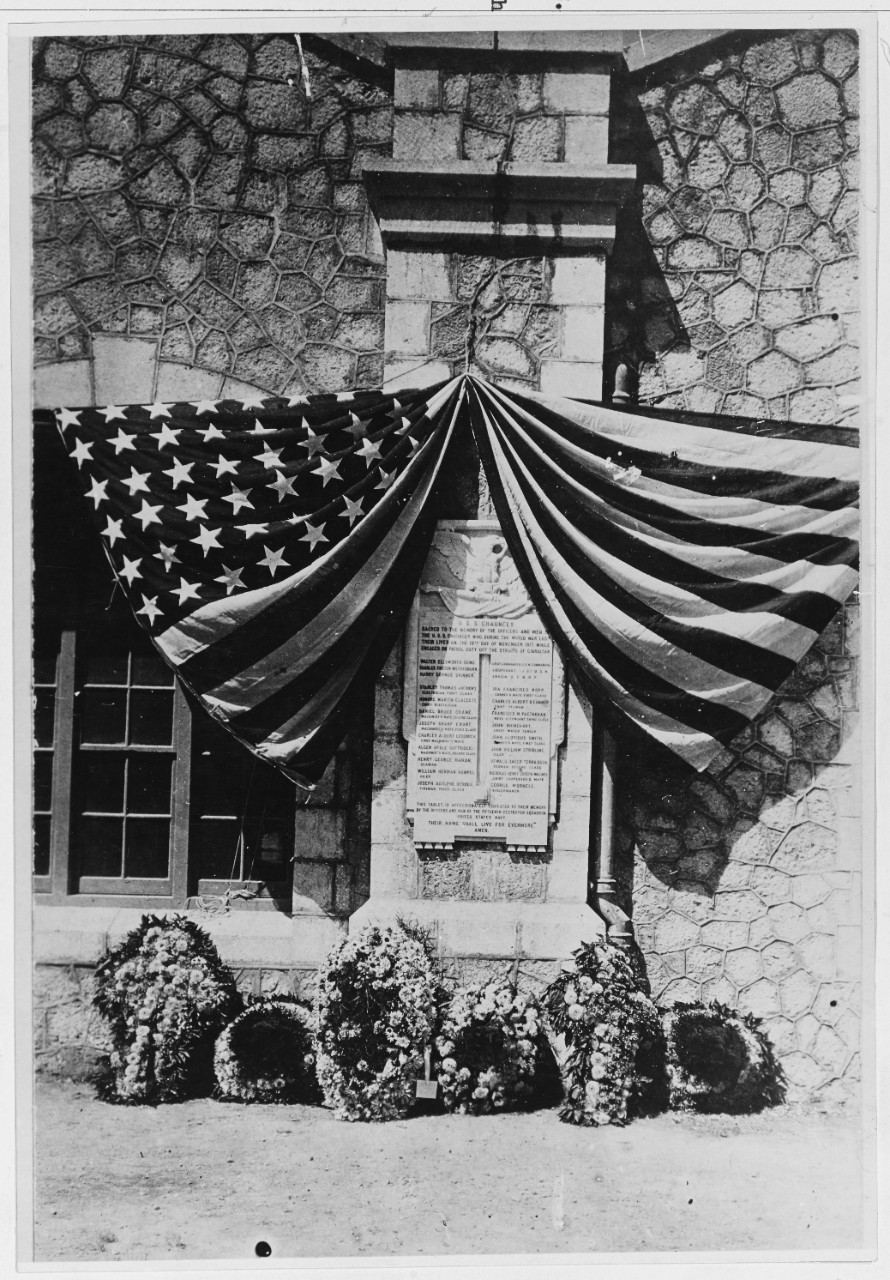 Memorial tablet erected by the officers and men of Destroyer Squadron Fifteen in memory of the three officers and eighteen enlisted crewmen lost with Chauncey on 20 November 1917. Photographed during the dedication ceremonies after World War I. (Naval History and Heritage Command Photograph NH 42002)