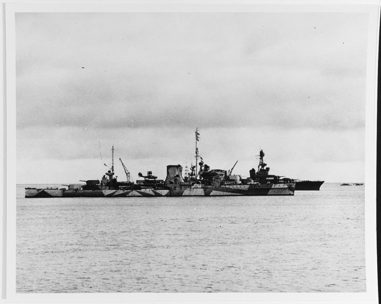 Chicago joins the ANZAC Squadron at Suva in the Fiji Islands in this picture taken from Curtiss, February 1942. Achilles faces the camera, and Chicago is visible just beyond the New Zealand light cruiser. A PBY Catalina is in the water in the distance. (U.S. Navy Photograph 80-G-7294, National Archives and Records Administration, Still Pictures Branch, College Park, Md.)
