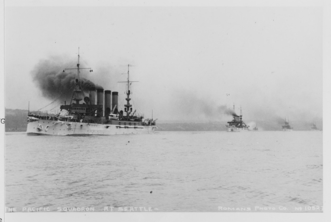 Pennsylvania (Armored Cruiser No. 4) or Colorado lead a column of four armored cruisers into Puget Sound toward Seattle, Wash. Photograph taken circa 1907–1908 and published on a postal card by Rodman's “Real Photo” Post Cards, sold by Hopf Brothers Co., Seattle, and postmarked at Seattle on 25 May 1908. (Courtesy of H.E. Coffer, 1986, U.S. Navy Photograph NH 101604, Photographic Section, Naval History and Heritage Command)