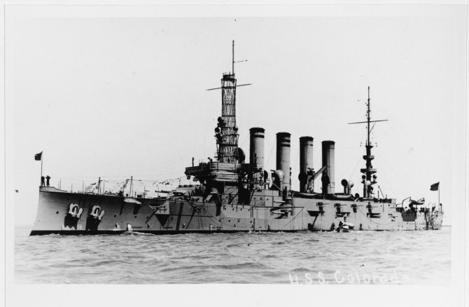Colorado in a harbor, probably on the Pacific Coast, circa 1916. The original image was printed on postal card (“AZO”) stock. (Donated by Thomas P. Naughton, 1973, U.S. Navy Photograph NH 92176, Photographic Section, Naval History and Heritage Command)