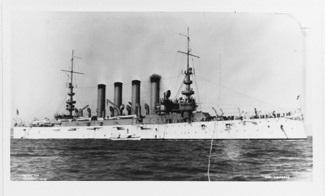 Colorado shimmers in the sun with a fresh coat of paint, circa 1905–1906, probably while anchored in Hampton Roads, Va. (Taken by C.E. Waterman, U.S. Navy Photograph NH 94583, Photographic Section, Naval History and Heritage Command)