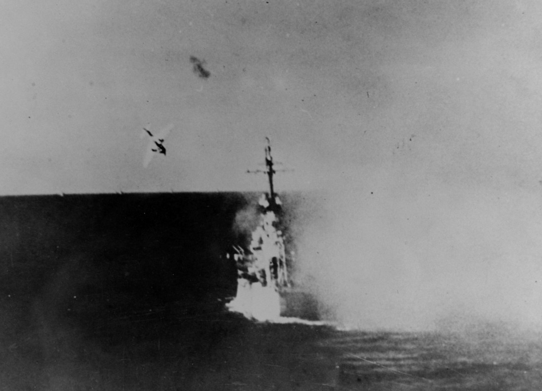 A Japanese Aichi D3A Type 99 Val that dove fatally into Columbia at 1729—the second hit during the day resulting in heavy casualties, significant damage to her after main turrets, and extensive damage below deck when the Val’s bomb exploded, 6 January 1945. (Naval History and Heritage Command Photograph NH 79449)