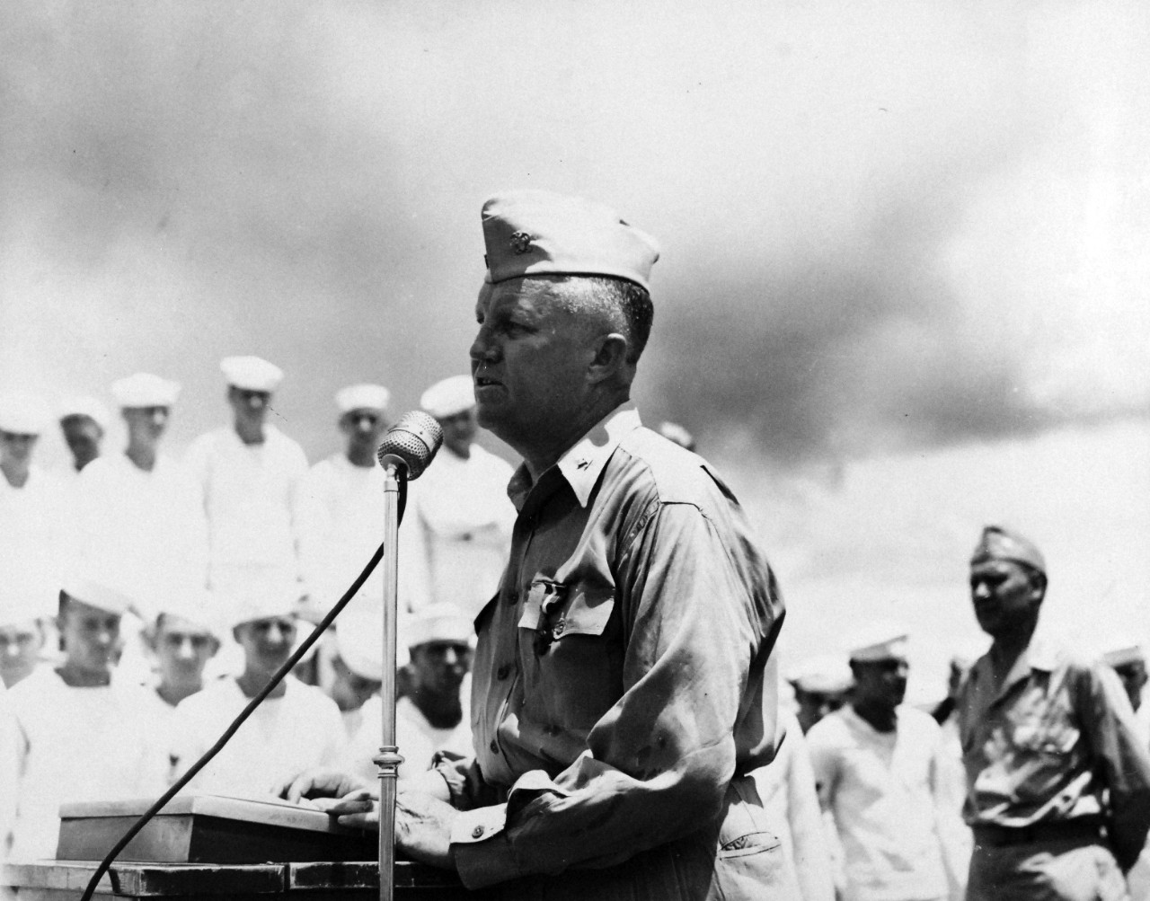 Capt. Frank E. Beatty giving a thank you speech upon presentation of his Navy Cross, and crew awards associated with the 1-2 November 1943 Battle of Empress Augusta Bay, 1 February 1944. (U.S. Navy Photograph 80-G-216848, National Archives and Records Administration, Still Pictures Branch, College Park, Md.)