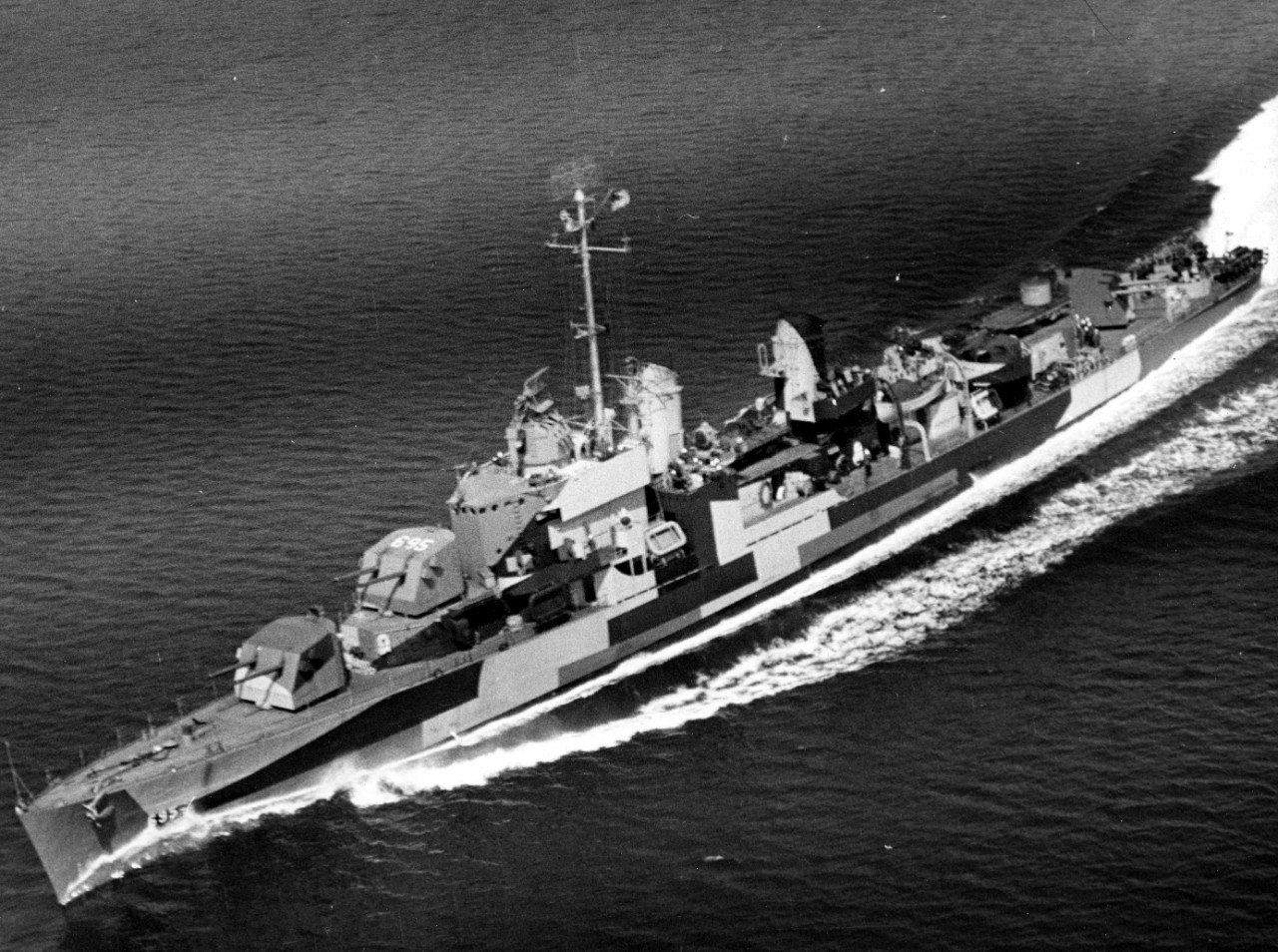 Cooper at speed, 24 April 1944, in a view that shows her port side Measure 32 Design 3D camouflage. The darkest color is Dull Black, the medium color Ocean Gray 5-O (which is also carried onto areas of the otherwise Deck Blue 20-B), and the lightest color is Light Gray 5-L. Note the modified bridge and identification number 695 on the crown of Mt. 52. (U.S. Navy Photograph 80-G-225110, National Archives and Records Administration, Still Pictures Division, College Park, Md.)