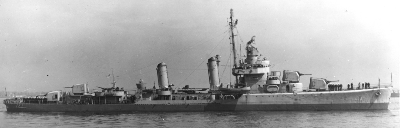 Starboard broadside view of Corry at Boston, 2 April 1943, in two-tone camouflage, with the darker lower color running parallel to the horizon and not following the sheer of the forward part of the vessel. (U.S. Navy Bureau of Ships Photograph BS 42484, National Archives and Records Administration, Still Pictures Division, College Park, Md.)