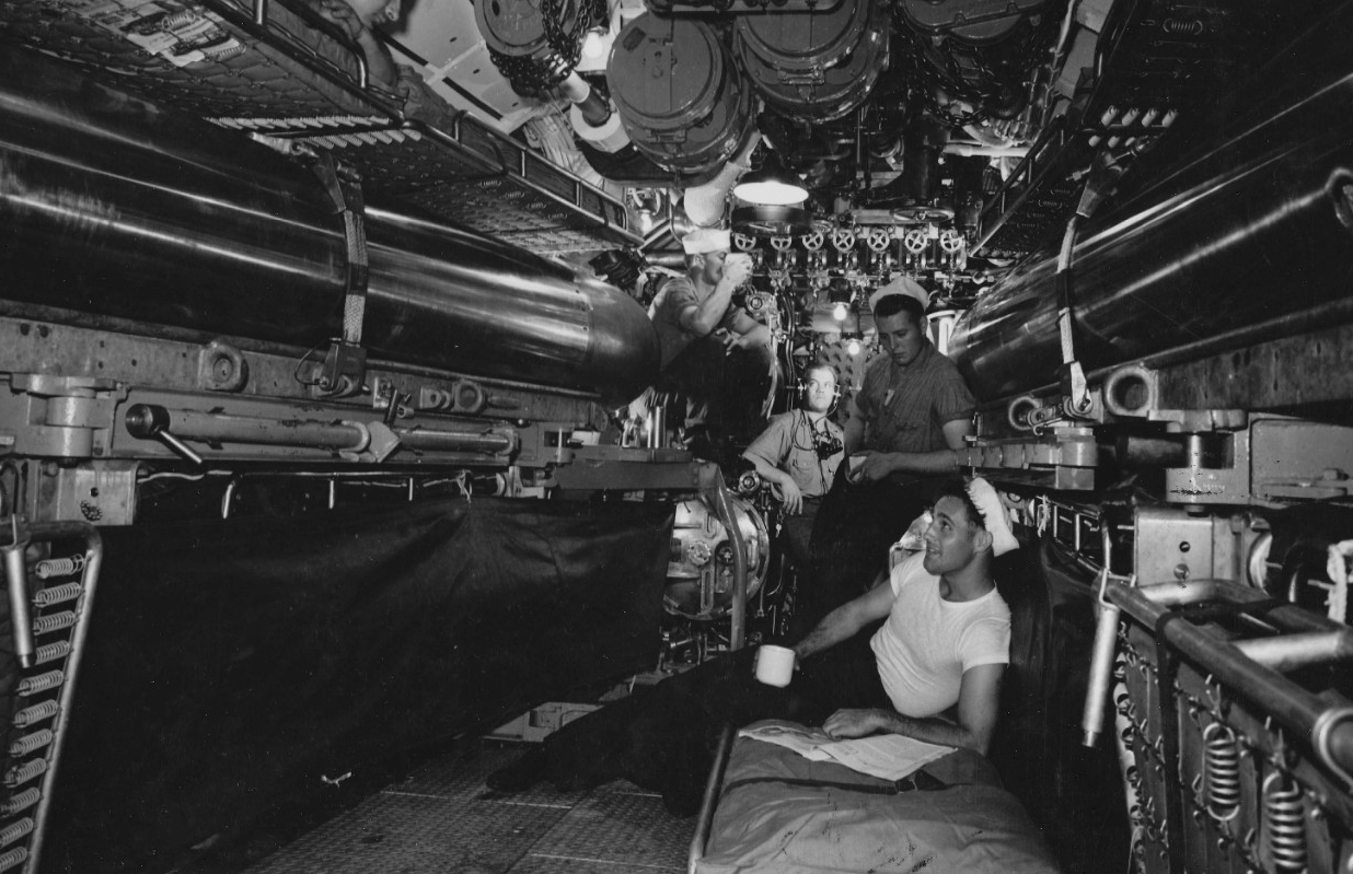 Corvina crewmen relax and drink coffee in the torpedo room at the submarine base at New London, Conn., in August 1943. (U.S. Navy Photograph 80-G-468673, National Archives and Records Administration, Still Pictures Division, College Park, Md.)