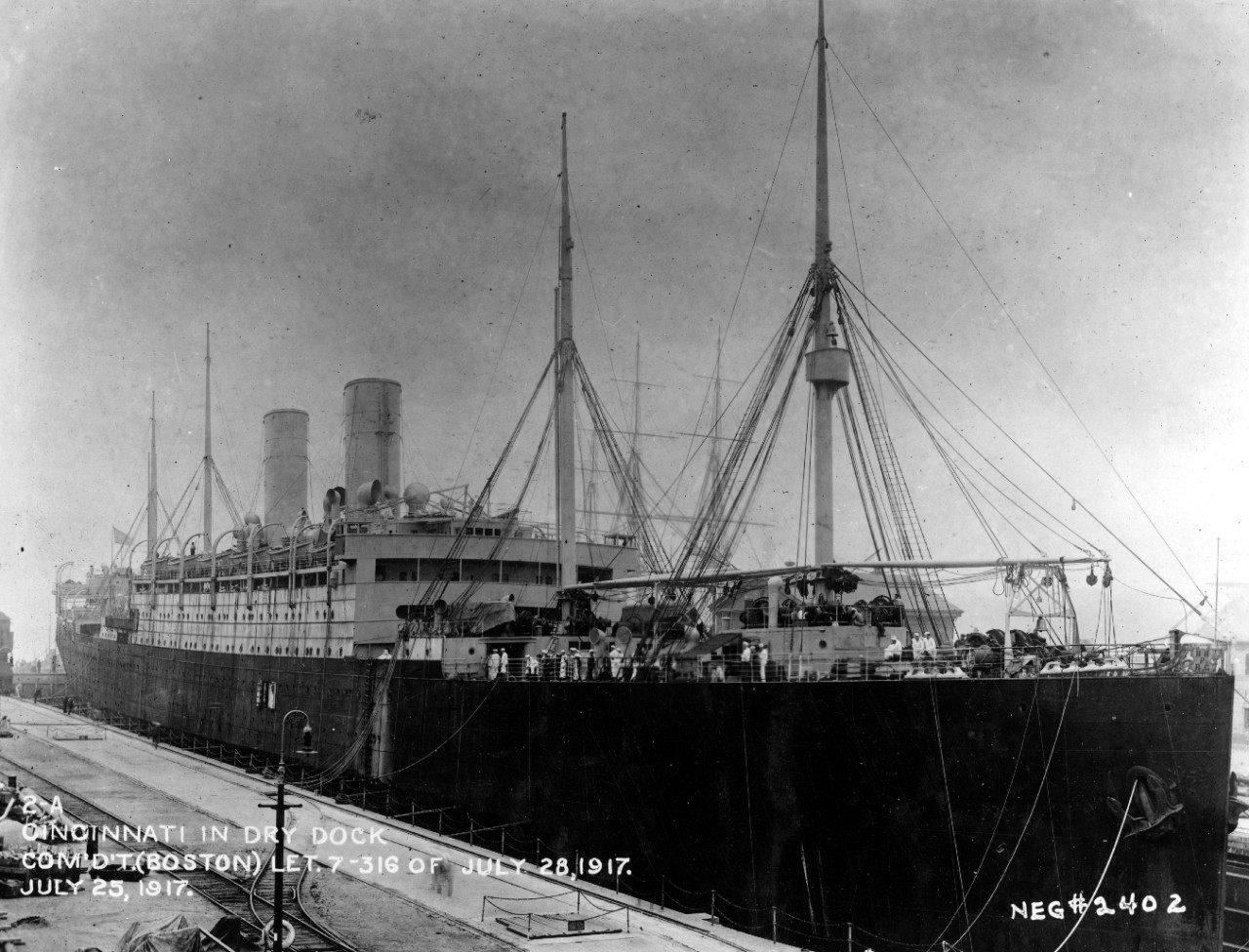 Cincinnati in dry dock, Boston Navy Yard, 25 July 1917. Note masts of the frigate Constitution in the background. (U.S. Navy Bureau of Ships Photograph 19-N-2402, National Archives and Records Administration, Still Pictures Division, College Park, Md.)