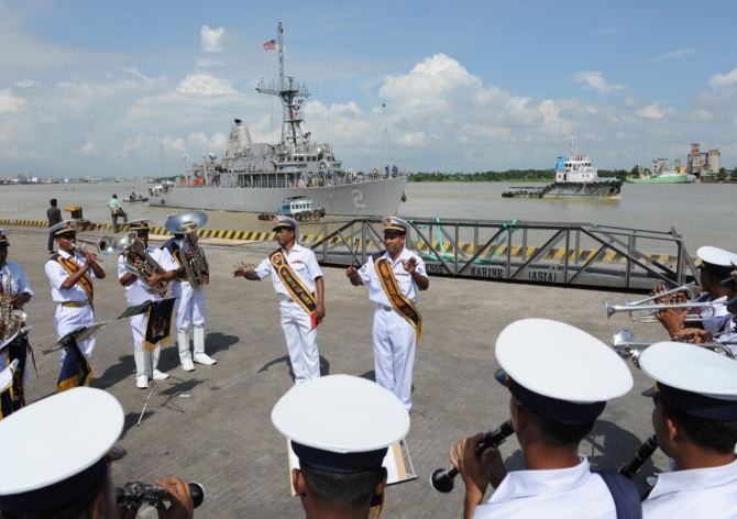 The Bangladesh Navy Band performs as Defender arrives in Chittagong, Bangladesh on 18 September 2011. The ship was in port for Cooperation Afloat Readiness and Training (CARAT) Bangladesh 2011, a series of bilateral exercises held annually in Southeast Asia to strengthen relationships and enhance force readiness. CARAT Bangladesh 2011 marks the first time the Bangladesh navy has participated in the exercise series. (Mass Communication Specialist 1st Class Lowell Whitman, U.S. Navy Photograph 110918-N-HA376-084, Navy.mil Photos).