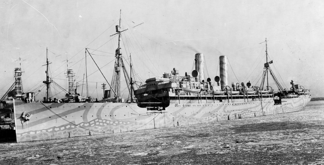 DeKalb moored at the Philadelphia Navy Yard, Pa., 18 February 1918. Note her camouflage scheme, ice in the Delaware River, and battleships in the left background. (Naval History and Heritage Command Photograph NH 54662)