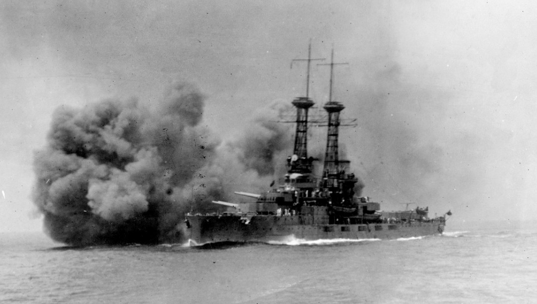 Delaware firing her 12-inch/45 caliber main battery guns during battle practice, 26 June 1920. Photographed by A.E. Wells. (Naval History and Heritage Command Photograph NH 60569)