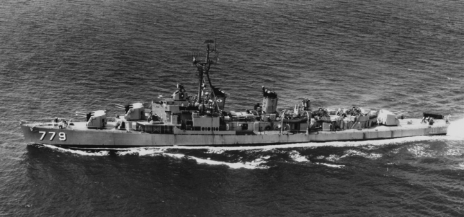 The ship, refitted with an antiaircraft battery of six 3-inch guns, steams at sea, 20 May 1957. (Unattributed U.S. Navy Photograph NH 99976, Photographic Section, Naval History and Heritage Command)