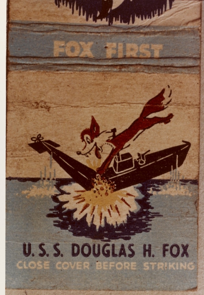 The ship’s emblem, printed on a matchbox cover, shows a fox pouncing on a submarine, most likely from the 1950s. (Unattributed U.S. Navy Photograph NH 88340-KN, Photographic Section, Naval History and Heritage Command)