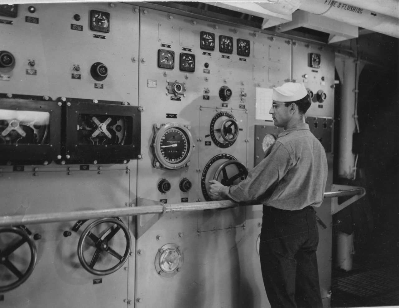 A sailor stands watch in Edgar G. Chase’s after motor room, monitoring the gauges at the propulsion control board, circa July 1944, (U.S. Navy Photo 80-G-238886, National Archives and Records Administration, Still Pictures Branch, College Park, Md.)