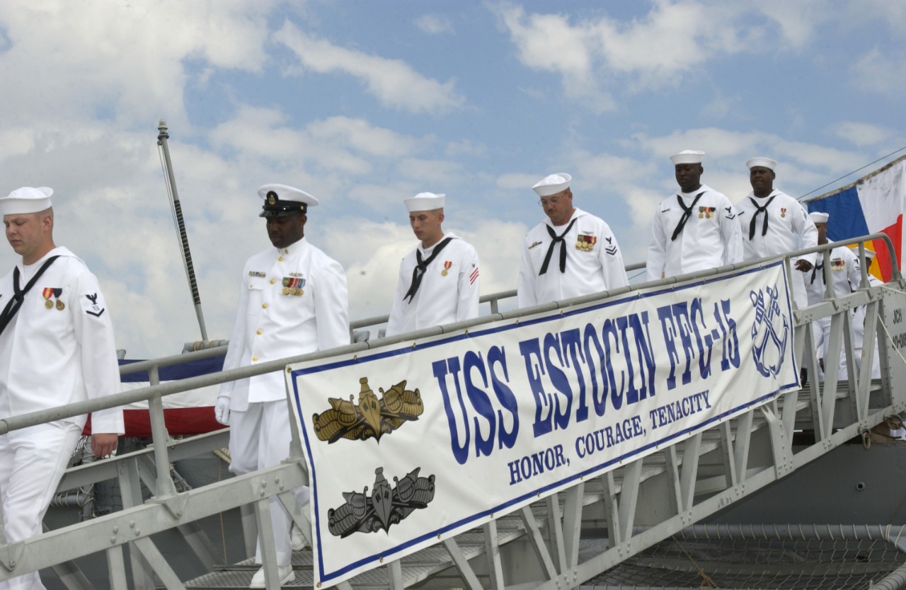 Estocin’s crew debarks for the final time during the frigate’s decommissioning ceremony, 4 April 2003. (U.S. Navy Photograph 030403-N-4649C-001, PH2 Chantel Chapman, Navy News Service)