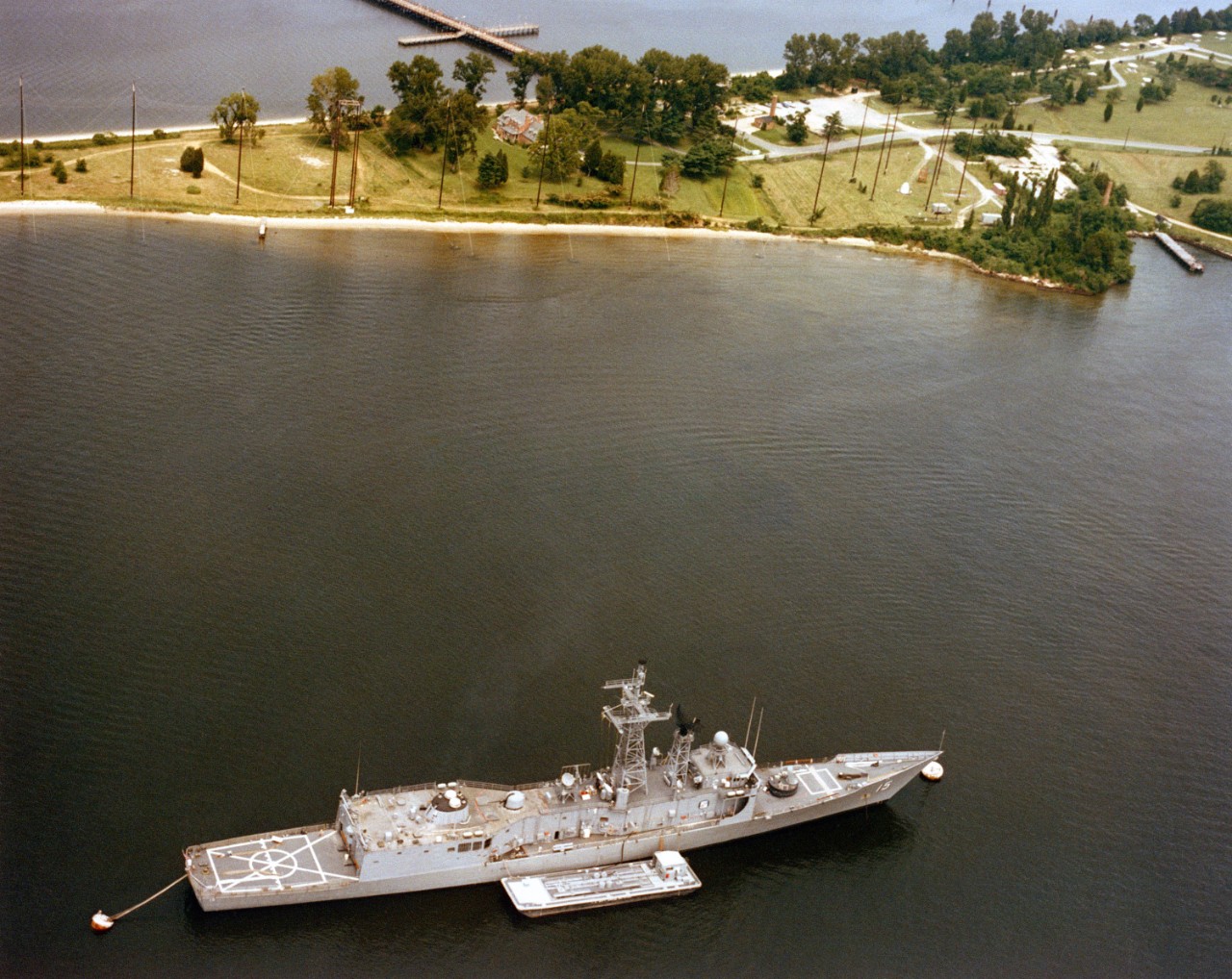 Estocin moored near the Electromagnetic Pulse Radiation Environmental Ship Simulator (EMPRESS) facility in Solomons, Md. (U.S. Navy Photograph DN-SC-86-03532, National Archives and Records Administration, Still Pictures Division, College Park, Md.)