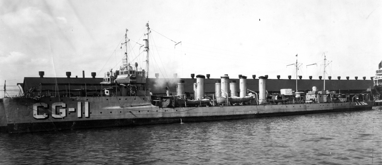 Fanning, awnings shading her decks as she lies moored alongside another destroyer, at New London. (Official U.S. Coast Guard Photograph, U.S. Coast Guard Historian’s Office, Fanning File)