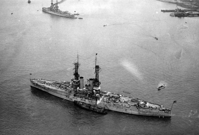 Florida photographed from the air, 23 April 1919, with Wyoming (BB-32) in the background. (Naval History and Heritage Command Photograph NH 61257)