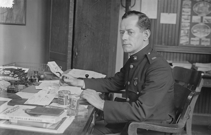 Capt. Evans pensively reflects for the camera as he works through his seemingly endless paperwork while preparing for the World War, 12 June 1917. (Library of Congress Photograph LC-B2- 4236-13)