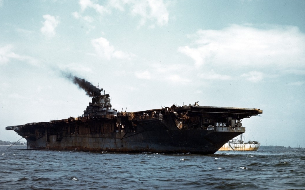 Franklin anchored in New York Harbor on 28 April 1945, awaiting damage battle repairs. Note her mauled flight deck. (U.S. Navy Photograph 80-G-K-4771, National Archives and Records Administration, Still Pictures Division, College Park, Md.)