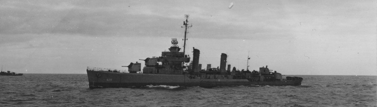 Glennon en route to Normandy, 4 June 1944, with the funnels of a British light cruiser visible in the background. (U.S. Navy Photograph 80-G-252264, National Archives and Records Administration, Still Pictures Division, College Park, Md.)