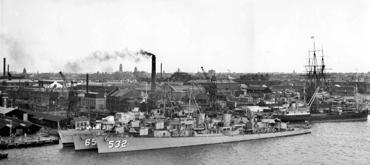 Heermann lies outboard of her sister ship Charles J. Badger (DD-657) at Portsmouth Dockyard, 15 July 1953, the U.S. destroyers nested with an unidentified British warship. Note the memorialized ship of the line HMS Victory in the background (R). (U.S. Navy Photograph 80-G-626623, National Archives and Records Administration, Still Pictures Division, College Park, Md.)