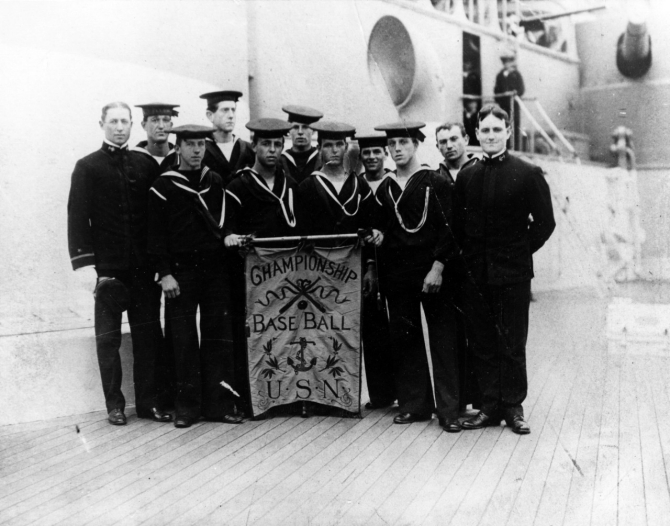 Members of the ship’s championship baseball team proudly display their award, circa 1907. (Naval History & Heritage Command Photograph NH 95329, courtesy of Paul E. Lorms, 1984)