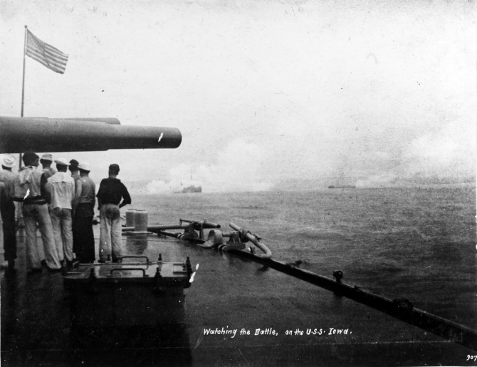 Sailors watch the Battle of Santiago de Cuba from Iowa’s deck, 3 July 1898. Note the dense smoke around the ship in the left center, and the close range of the Spanish ships, ablaze from the American gunfire. (Naval History & Heritage Command Photograph NH 1132, copied from the Journal of Naval Cadet Cyrus R. Miller)