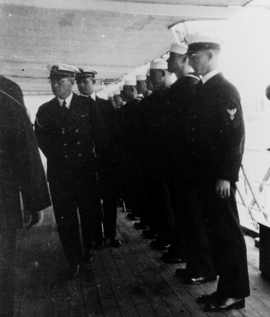 “The Skipper looks 'em over” -- Lt. Cmdr. Homer L. Grosskopf, Isabel's commanding officer, inspects her crew, circa 1932. (Naval History and Heritage Command Photograph NH 80130) 
