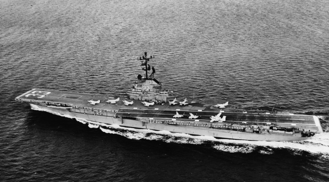 The ship steams at sea with nine Skyhawks and a Tracker visible on her flight deck, 12 December 1965. (PH3 Michael D. Stearns, Naval History and Heritage Command Photograph 1117602)