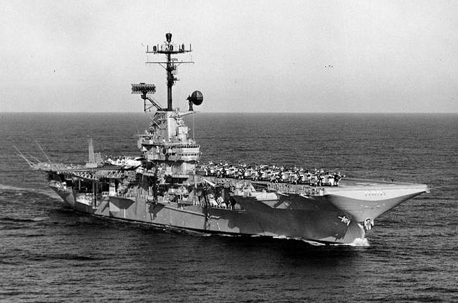 Kearsage’s island bristles with radar, radio, and electronic warfare antennae and aircraft pack the flight deck as she steams in the serene Pacific, 5 December 1968. (Naval History and Heritage Command Photograph KN-18336)