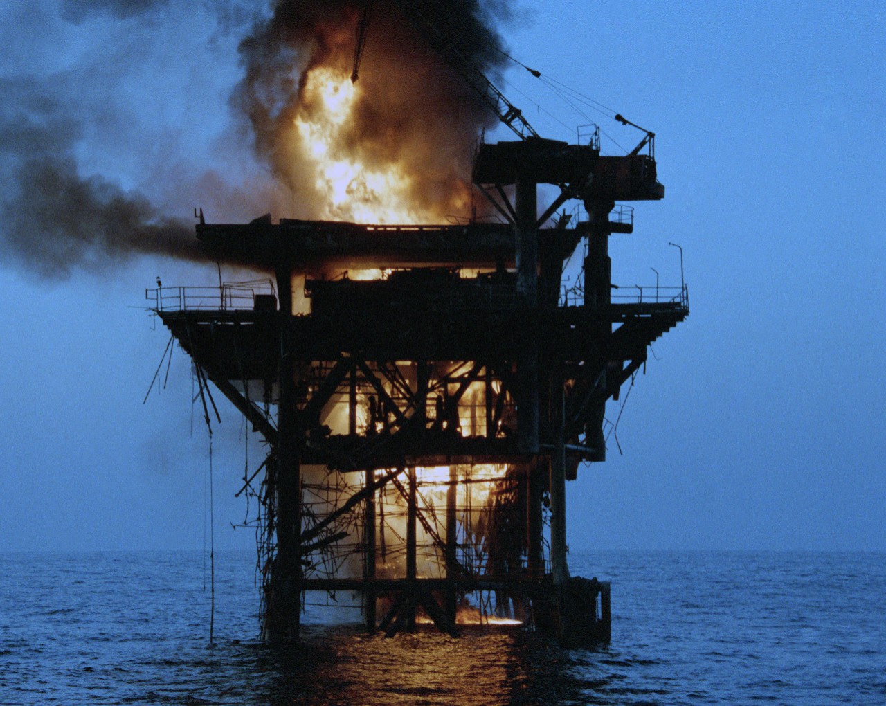 The “Ayatollah’s Eternal Flame” shortly after being ignited, 19 October 1987. (U.S. Navy Photo by PH3 Henry Cleveland, DIMOC #DN-SC-88-01042)  