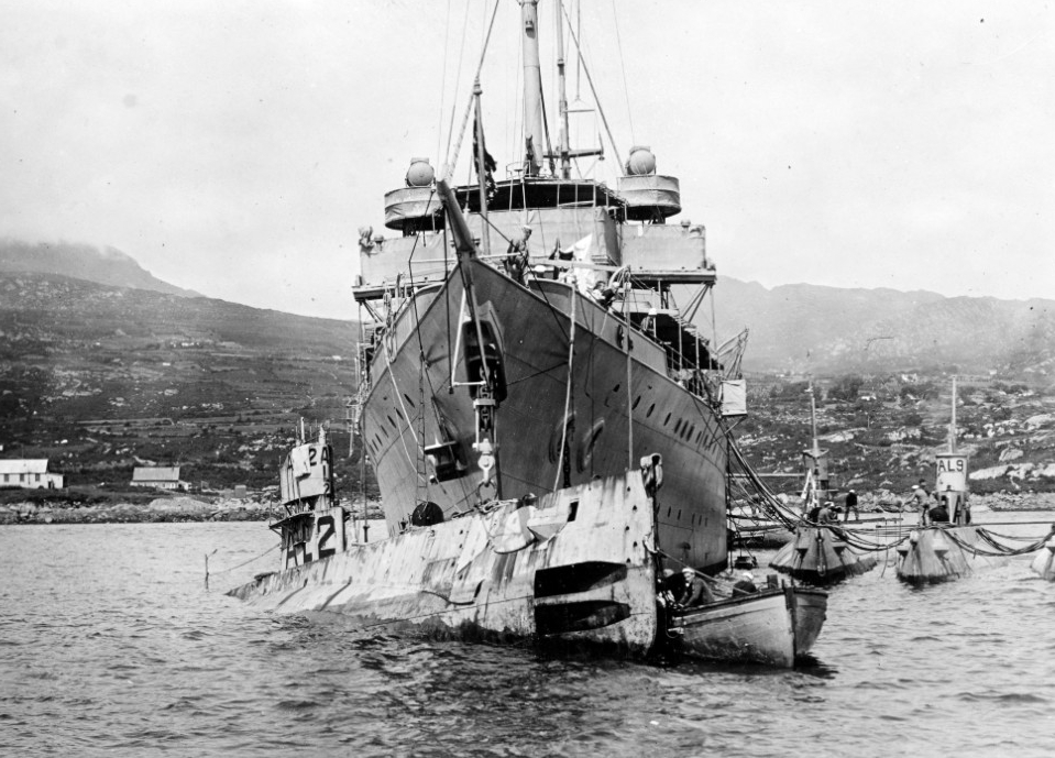 Bushnell lifting AL-2 partially out of the water, while in an Irish port.  AL-4, AL-9 and AL-1 (L-R) lie moored to the tender’s port side. (Naval History and Heritage Command Photograph NH 61684) 