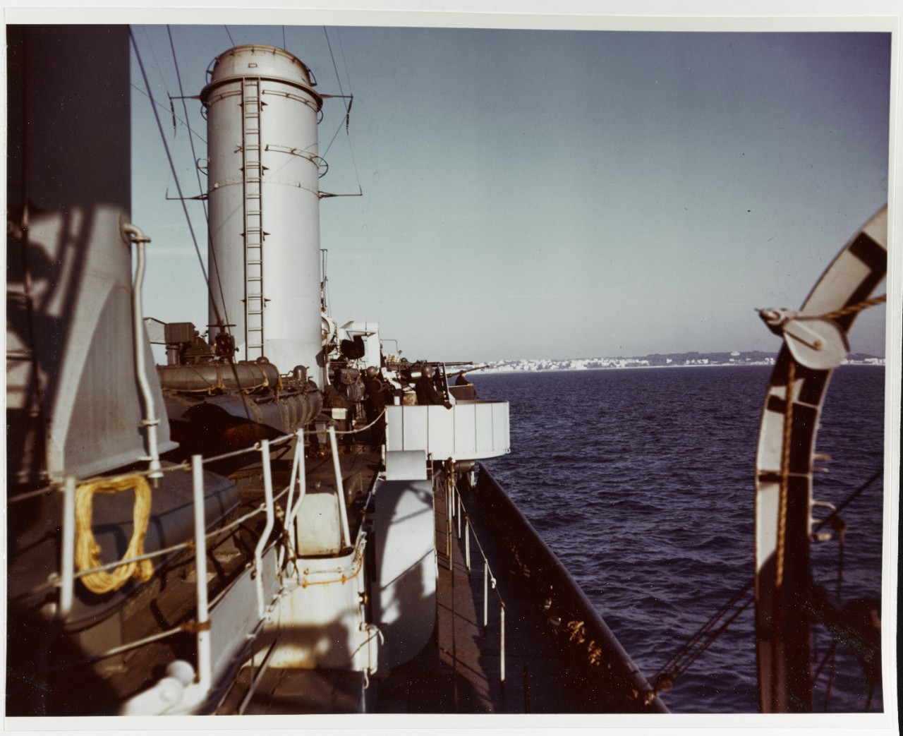 Livermore’s gun crews stand alert during a patrol of the waters off Anzio, which can be seen in the background, circa March 1944 by Combat Photo Unit Ten. (U.S. Navy Photograph 80-G-K-13779, National Archives and Records Administration, Still Pictures Division, College Park, Md.)