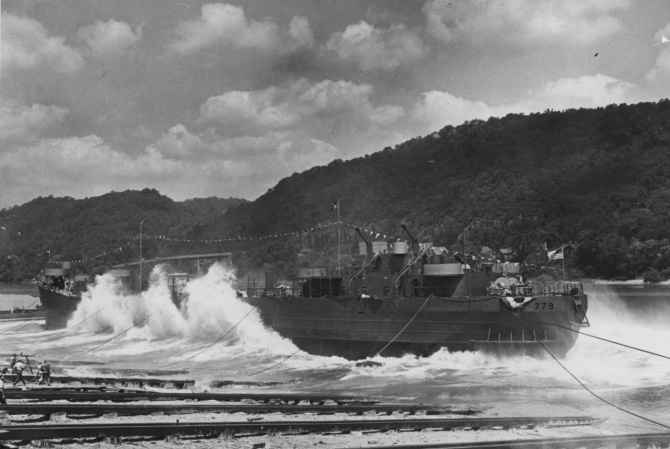 LST-779 enters her element, the restricted areas of inland waterways necessitating a side launch, 1 July 1944. (U.S. Navy Bureau of Ships Photograph 19-N-67843, National Archives and Records Administration, Still Pictures Branch, College Park, Md.)